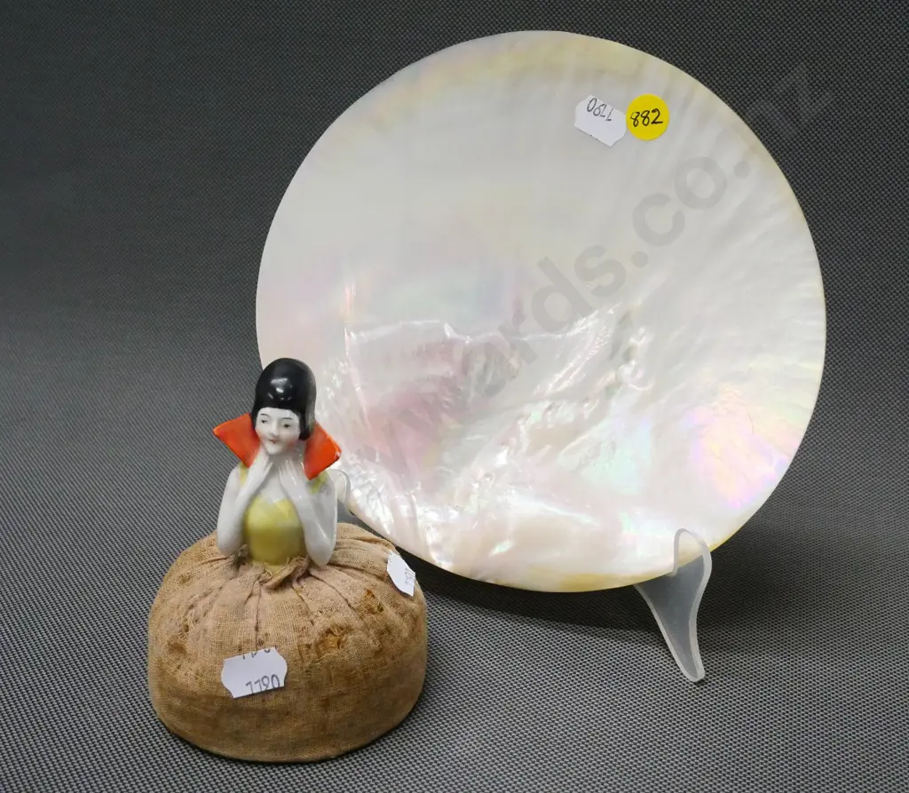 half-doll pin cushion and a large polished mother of pearl shell approx H-190 W-190 Image 1++