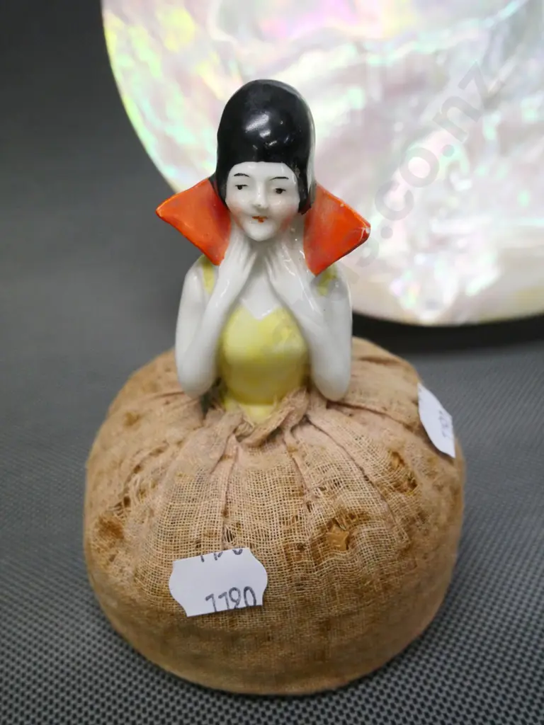 half-doll pin cushion and a large polished mother of pearl shell approx H-190 W-190 Image 1++