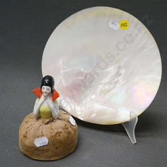 half-doll pin cushion and a large polished mother of pearl shell approx H-190 W-190