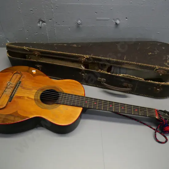 vintage acoustic guitar with painted back, various replacement strings, case