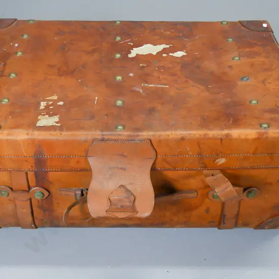 bullock hide travel trunk - brass studs and hardware, interior satchel embossed John Pound & Co London H-350 W-840 D-550