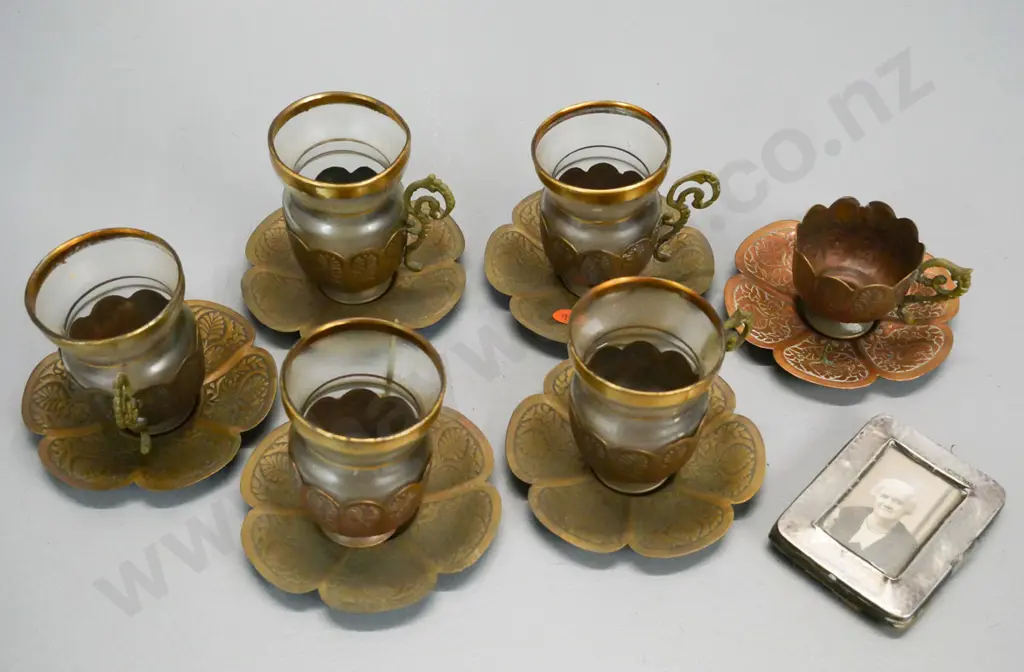 set of 6 copper relief pattern coffee cups & saucers, one missing glass, and a sterling silver small photo frame Image 1++