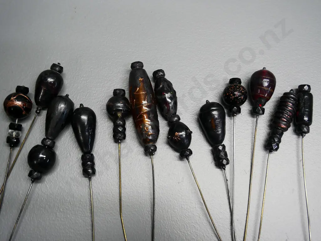 numerous vintage hat pins in fabric covered cushion - some are glass Image 1++