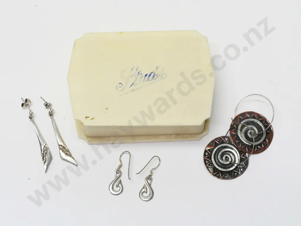 3 pairs of earrings - stamped 925 on hoop no marks on the other 2 in a bakelite container with Studs written on top Image 1++