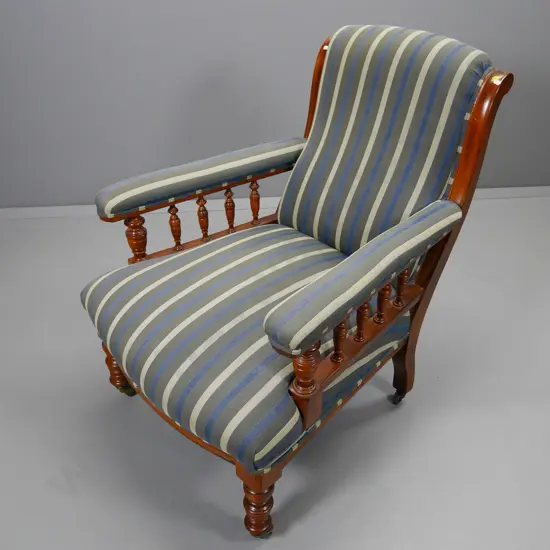 vintage wood-framed armchair w/turned legs & spindle sides, metal casters, striped damask upholstery H940 W730 D800