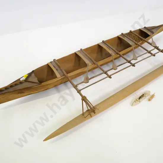wooden model of an outrigger canoe and 2 tiny balsa wood ship models. Canoe is H-80 L-770 W-230