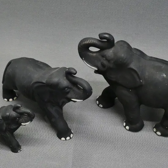 3 English (Sylvac?) black matte glaze china elephants, marked 769 & 768L, no number on largest, numerous flecks to glaze
