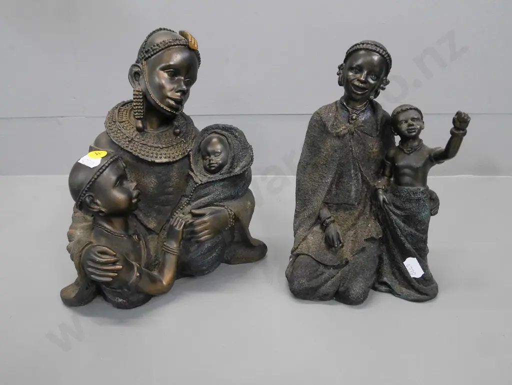 2 composite native woman and children figures, 1 has damage to foot Image 1++