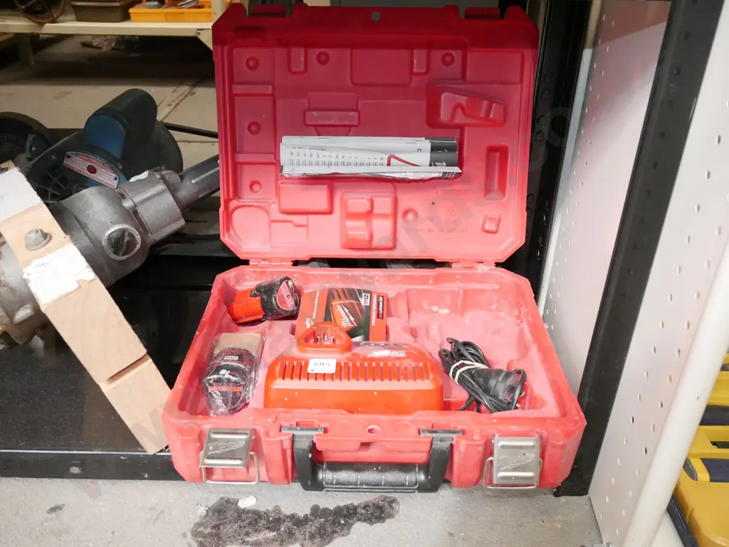 cased Milwaukee battery powered case with battery charger and 2 batteries - batteries in office Image 1++