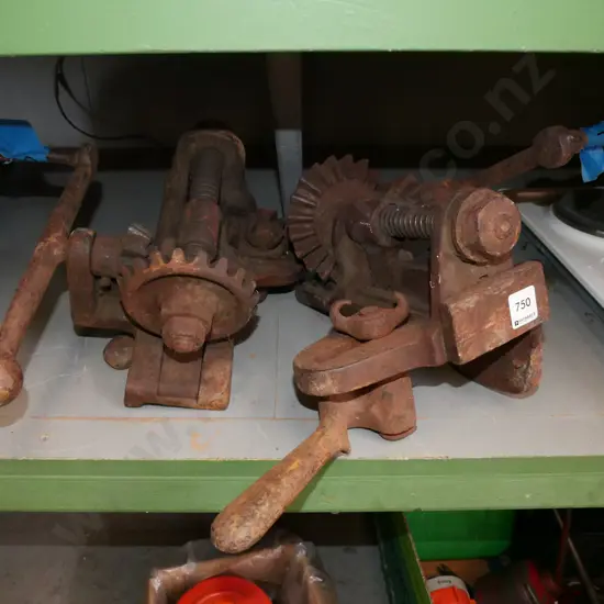 pair of rusty floor clamps
