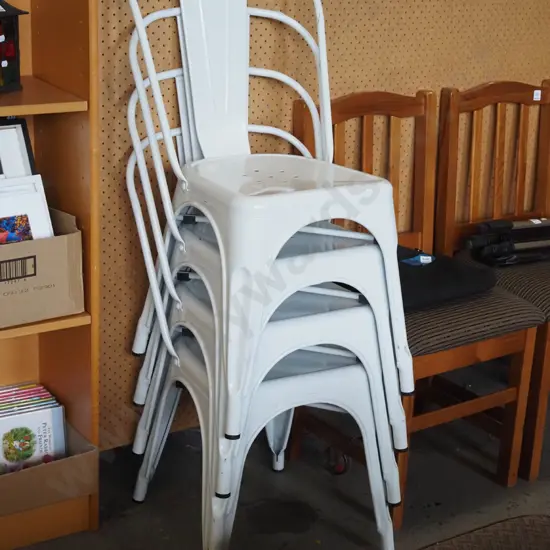 4x white metal stackable chairs