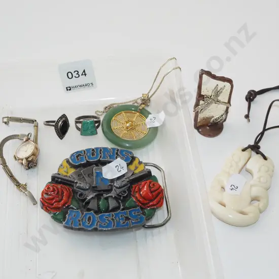 tray; belt buckle, wristwatch, carved tiki etc