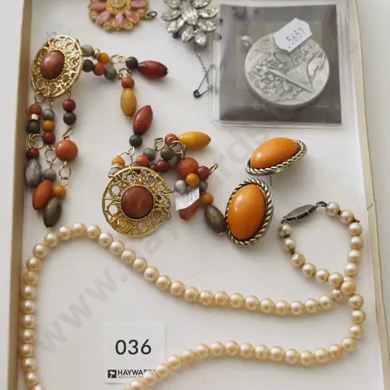 tray; necklace, earrings, medallion 