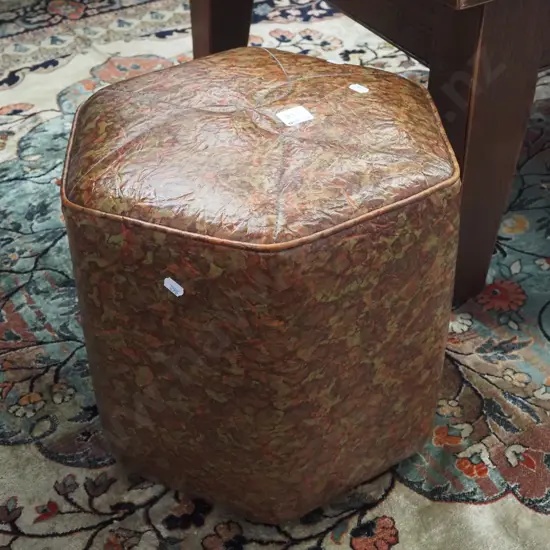 small vinyl ottoman - small tear to top