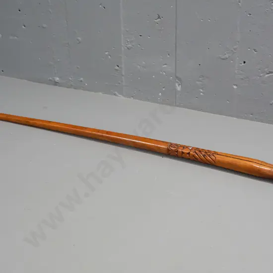 carved wood walking stick with clenched fist handle, Pacific island style motifs, missing ferrule, split thru centre