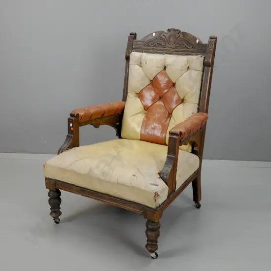 Victorian dark stained kauri & rimu open-arm leather upholstered armchair w/deep button back, fan shaped arm brackets,