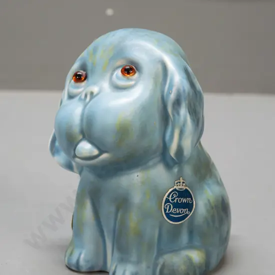 Crown Devon dog figure with applied glass eyes, original label, with Ballantyne's sticker on base H-140