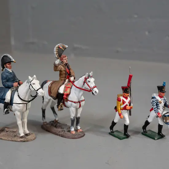 4 hand painted cast metal military figures - 2 larger on horseback have Del Prado sticker on base H-100 L-75