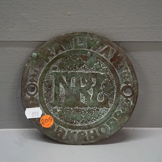 vintage NZR Railway Workshops cast brass bolt cover plate - warped and worn D-120