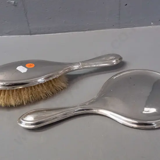 hallmarked sterling silver dressing table brush and mirror - some dents and a crease to silver of brush handle,