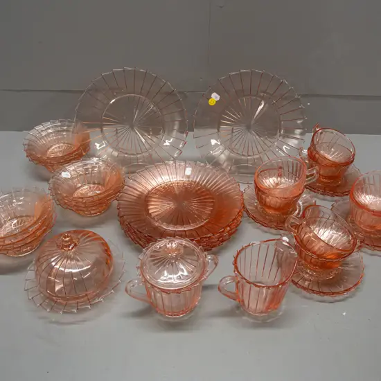 assorted cranberry depression glass tableware: 8 large plates, 9 sweet dishes, 8 cups/saucers, cream sugar
