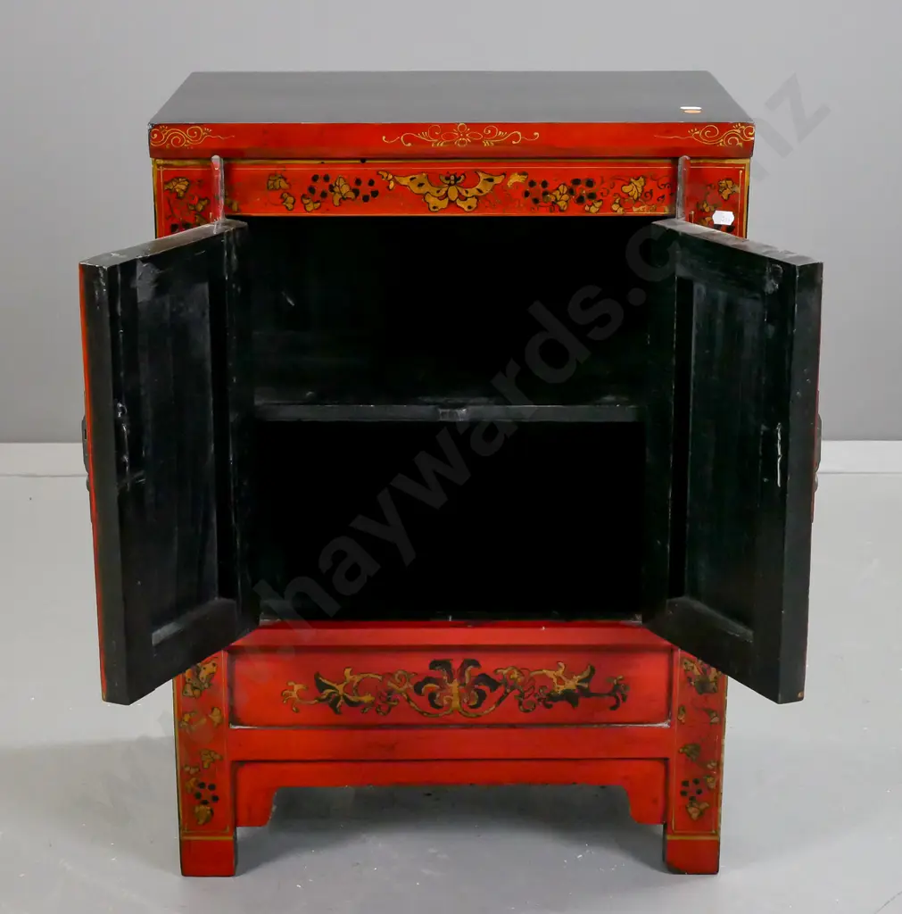 small Chinese 2-door black and red cupboard, front decorated w/ polychrome figural, bat and moth motifs, brass catch Image 1++