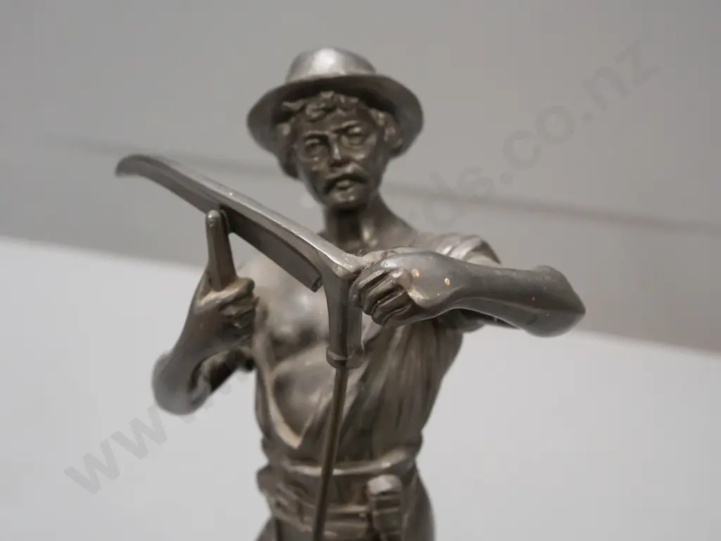 cast metal figure on composite stone base, farmer sharpening scythe. H-320 Image 1++