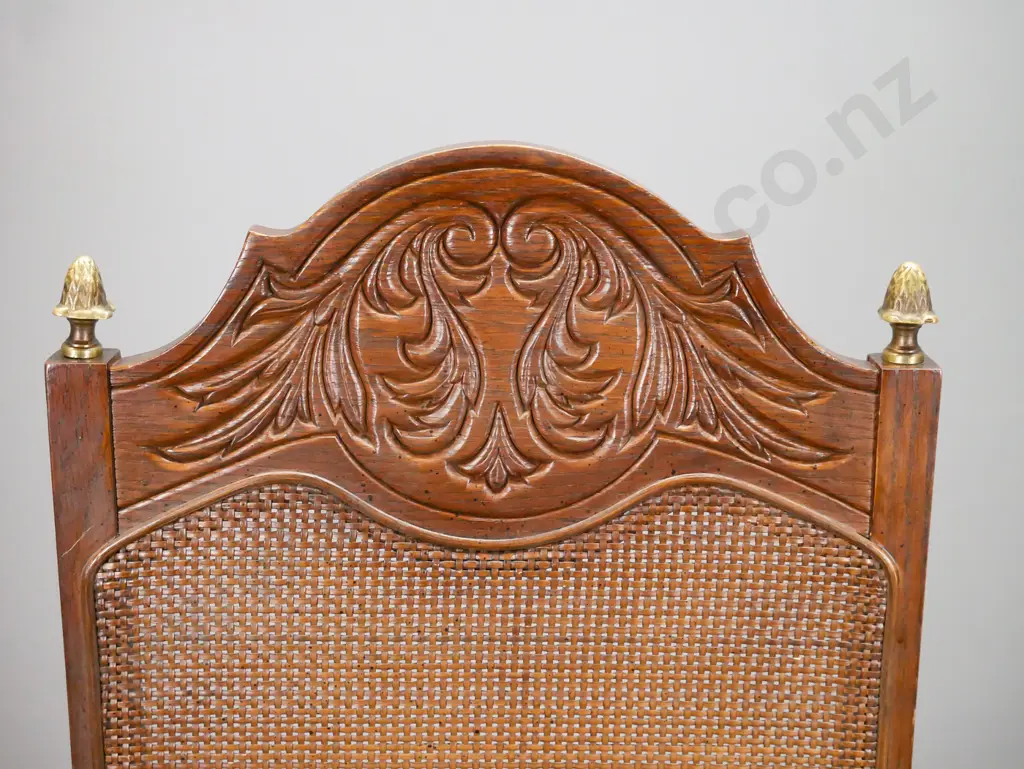 vintage oak and elm open-arm chair with tight-weave cane back, carved foliate decoration, brass finials, turned & Image 1++