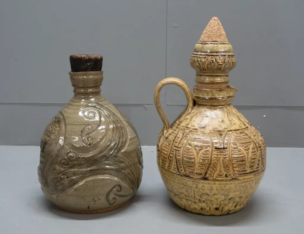 2 heavy studio pottery stoppered jugs - handled and incised gold and brown with unknown "R" maker's mark and unusual Image 1++