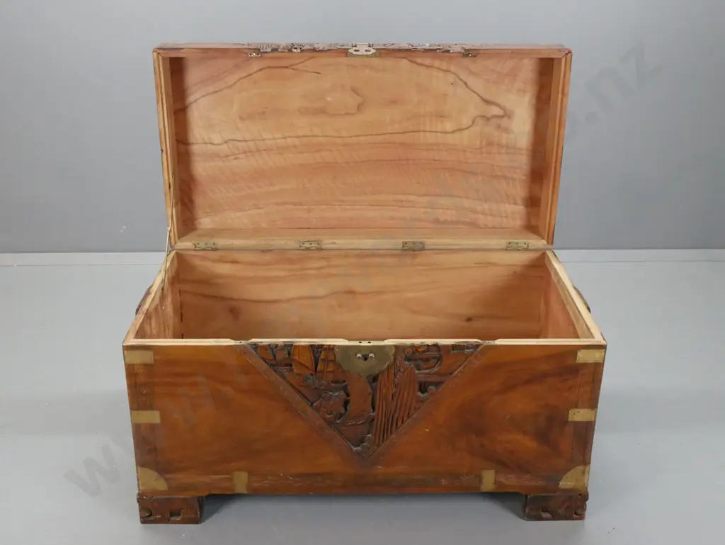 vintage Chinese carved camphorwood chest with brass strapping and corners w/ carved block side handles and feet, shaped Image 1++