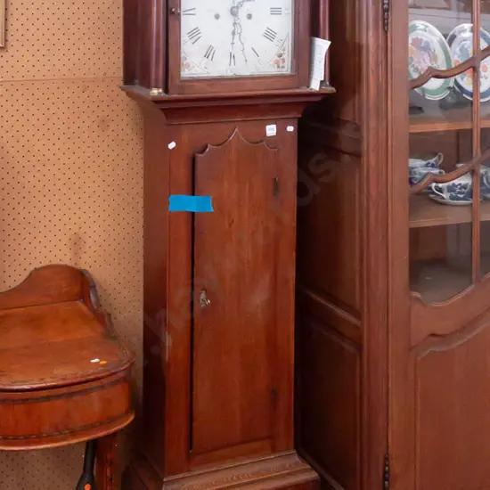 late Georgian long case clock with breakarch dial, painted enamel face by Rust of Hull, movement c 1790.