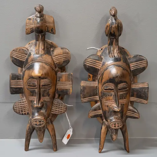 2 African carved wood ornamental bird motif wall masks - age wear. Larger is H-360