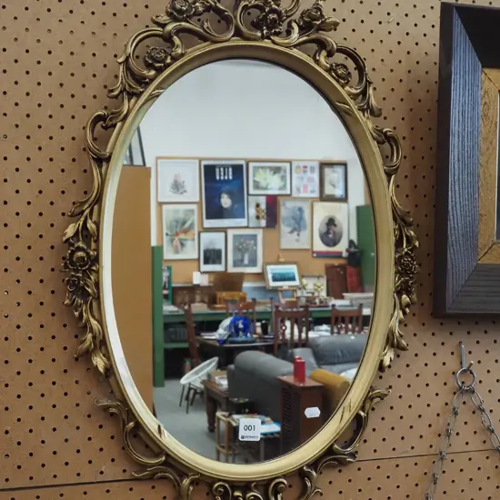 ornate gilt framed wall mirror