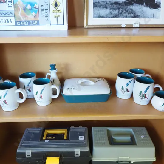 shelf of Denby green wheat; cups, baking dish, creamer etc