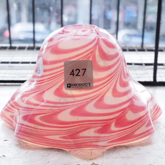 pink and white swirl patterned light shade