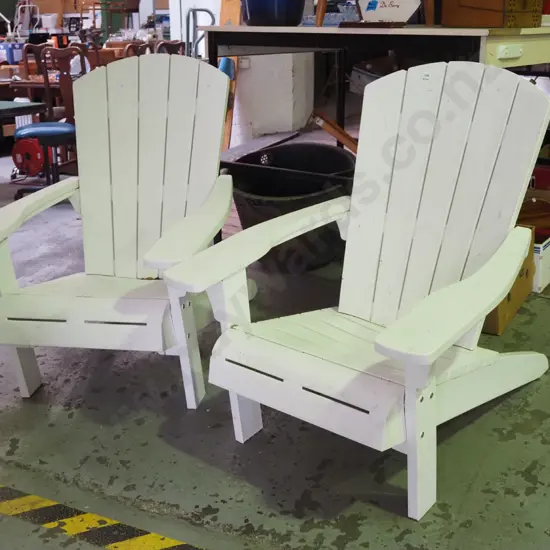 pair of white plastic Cape Cod chairs