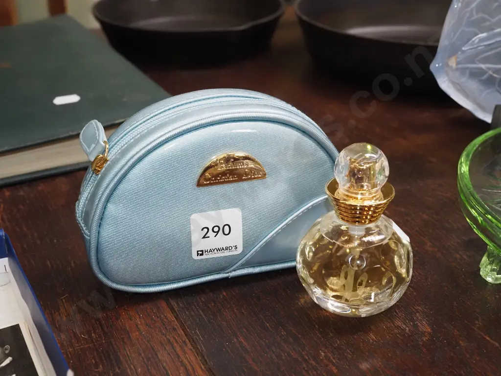 bottle of Christian Dior eau de toilette 30ml and makeup purse Image 1++