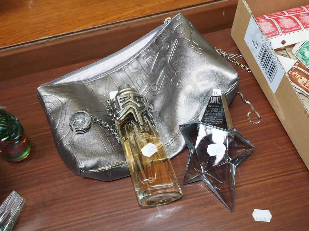 bottle of Womanity 50ml, bottle of Angel eau de parfum 25ml Image 1++