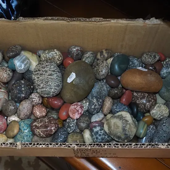 box of polished stones