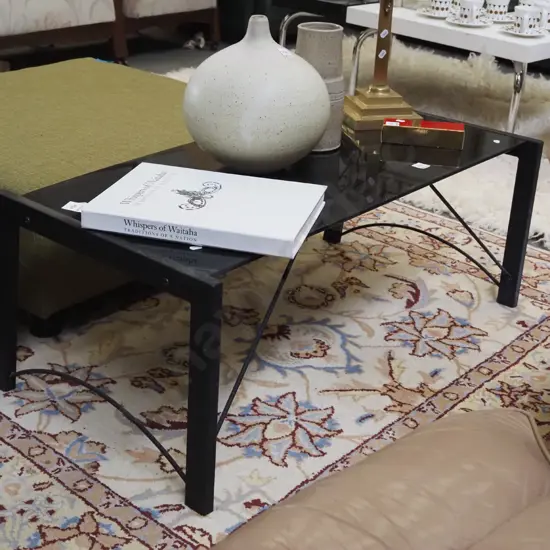black glass and metal coffee table