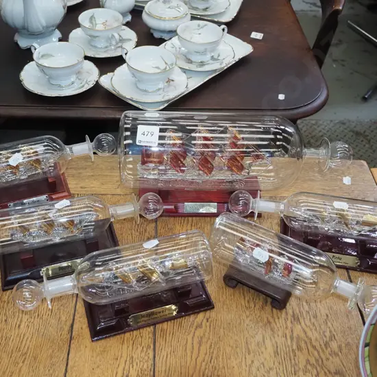 5x glass ships in bottles on stands L310