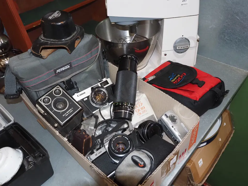 box of film,cameras, bags and accessories and a Sony digital camera Image 1++