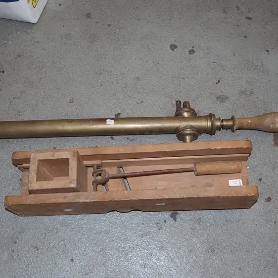 vintage brass garden sprayer and wooden slicer