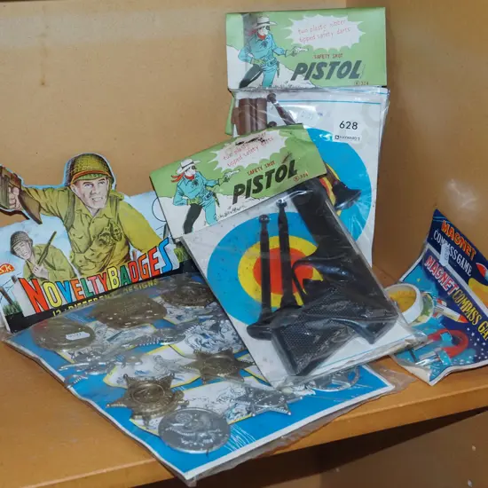 plastic toy guns, novelty badges