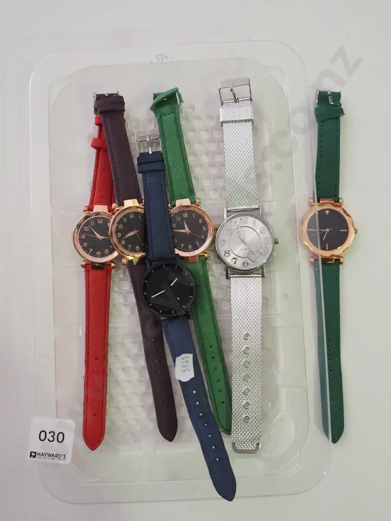 tray of wristwatches Image 1++