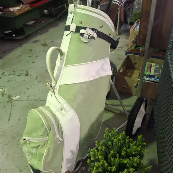 golf cubs and trundler, 10 golf balls and tees