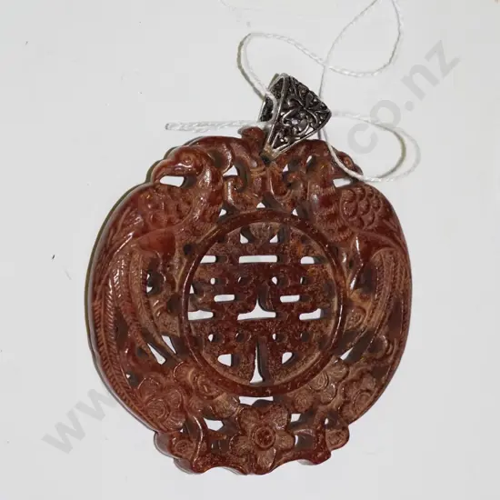 large Mexican carved stone medallion with stirling silver loop