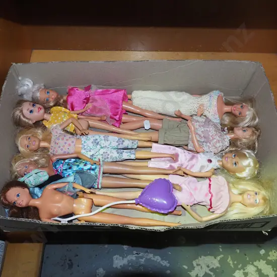 box of Barbie dolls