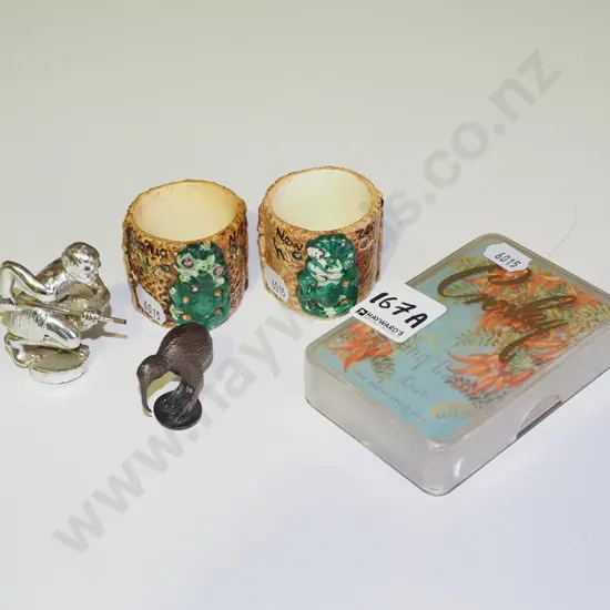 NZ souvenir items; 2 ceramic tiki egg cups (chips to paint), 2x cast metal figures, deck of kaka beak cards 