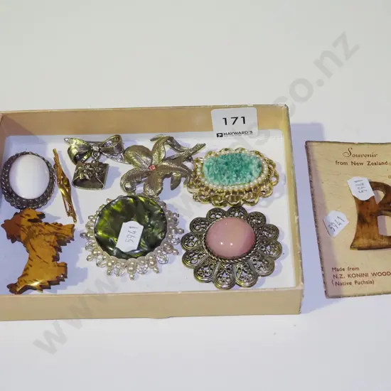 tray of various brooches